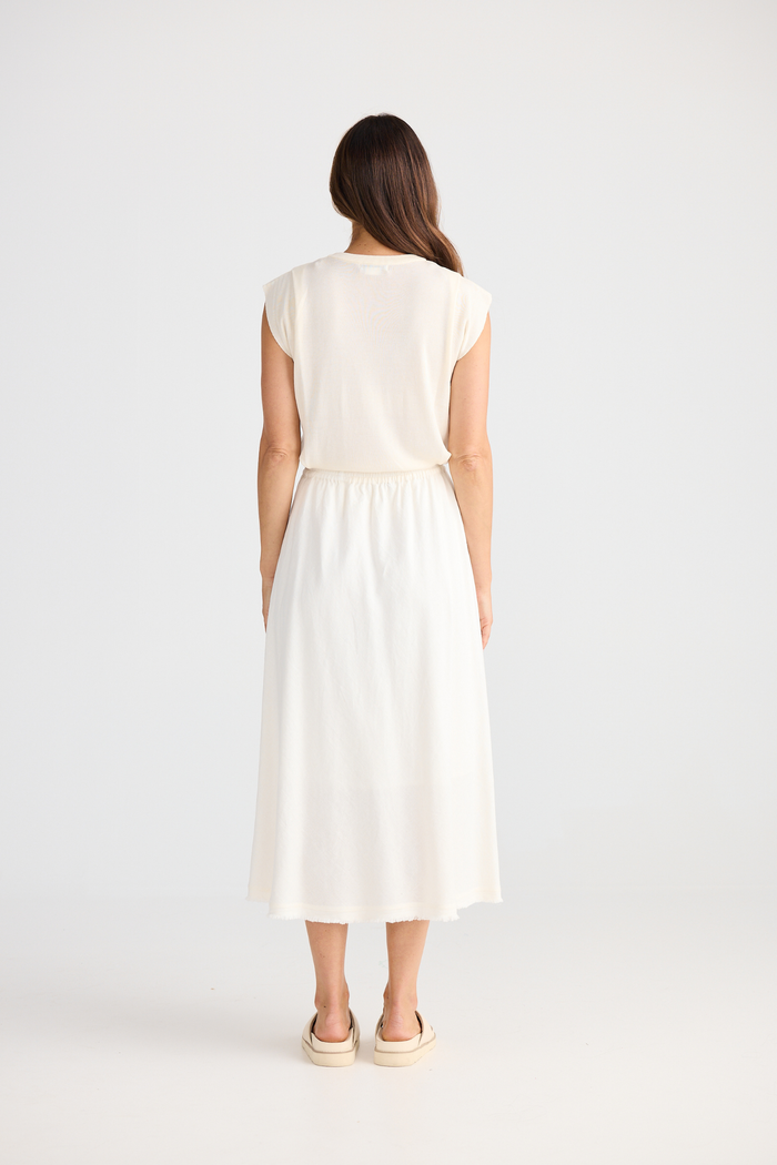 Brave + True Oakley Skirt in off white. Bias-cut midi skirt with elasticated waist, side splits and linen viscose fabric. Shop at Dotique.