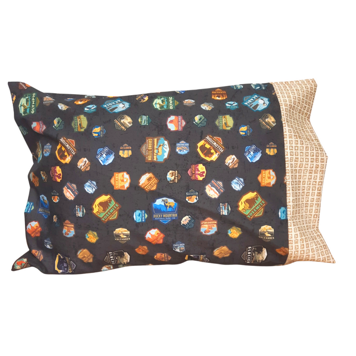 This pillowcase is a perfect gift for the National Parks enthusiast in your life. Standard Size measures 30" x 20" One pillowcase Washing Instructions: Machine Wash Cold/Tumble Dry Low Product designed and sewn by AdventureUs in Northern Wisconsin Materials: 100% cotton Riley Blake Designs™ National Parks Badges fabric