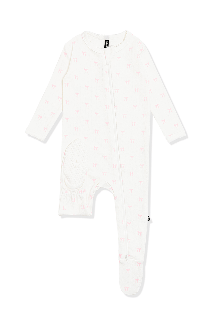 The bottom of the foot showing the kyte baby logo on the Pointelle Zippered Footie in Sweet Pink Bow