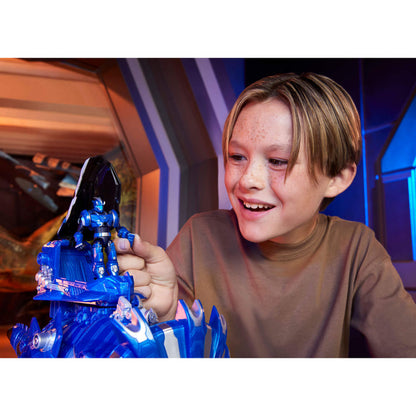 Child holding a blue toy with a smiling expression