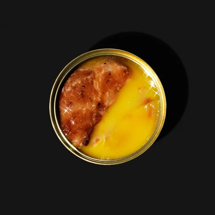 open can of fish packed in butter
