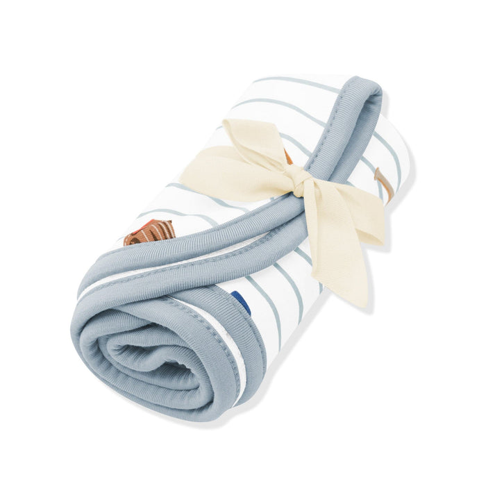 Burp Cloth in Home Run shown rolled in its packaging tied with a linen bow