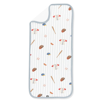 Burp Cloth in Home Run laid flat with the corner flipped down showing the bamboo terry cloth backing