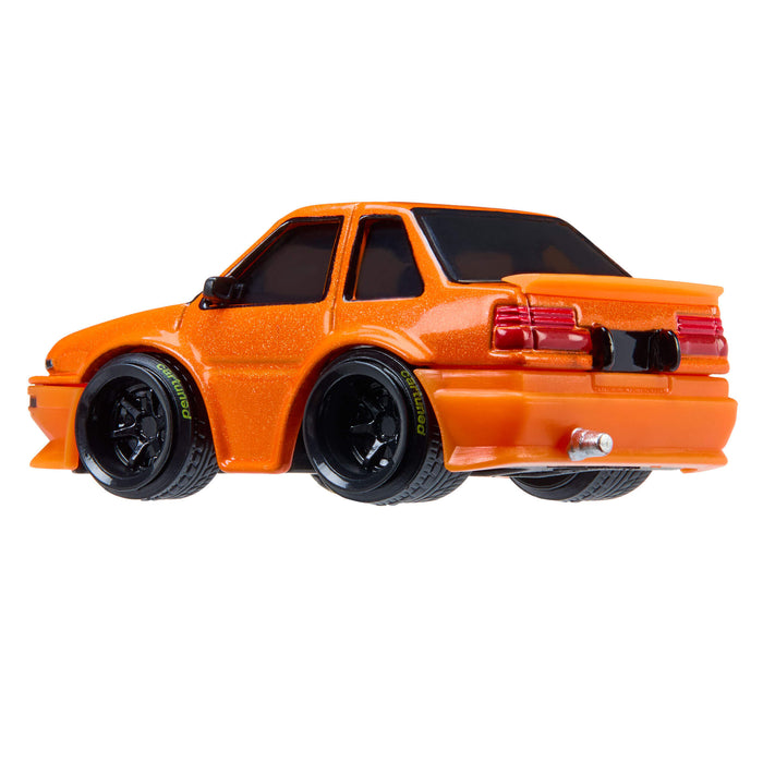 Orange toy car on a white background