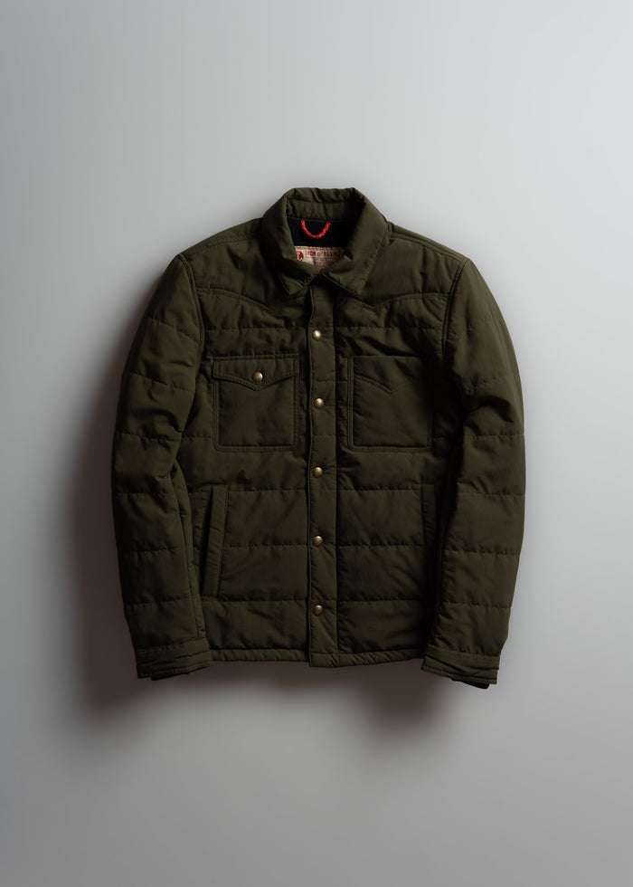Olive green quilted jacket with button closure and two chest pockets, displayed against a plain background.