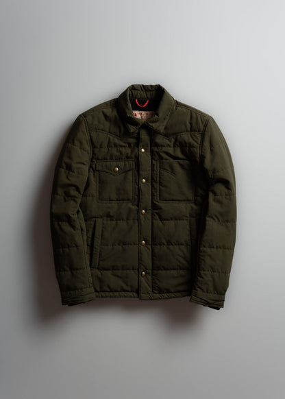 Olive green quilted jacket with button closure and two chest pockets, displayed against a plain background.