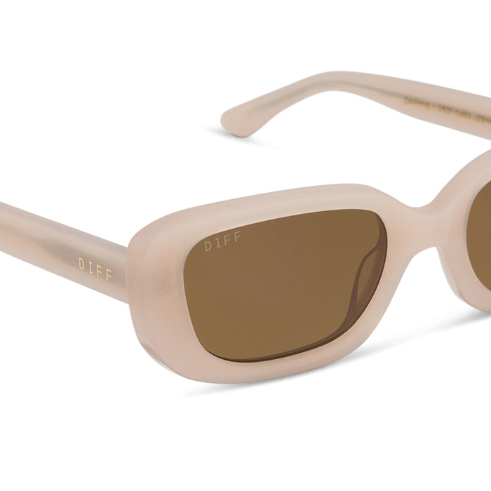 diff eyewear featuring the daphne ii rectangle sunglasses with a milky blush acetate frame and brown polarized lenses detailed view