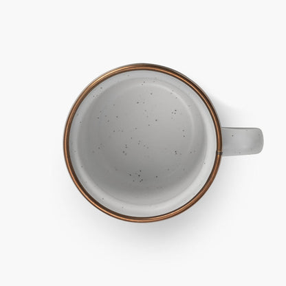 5 oz speckled eggshell enamel espresso cup with copper plated rim on viewed from above on a white background.