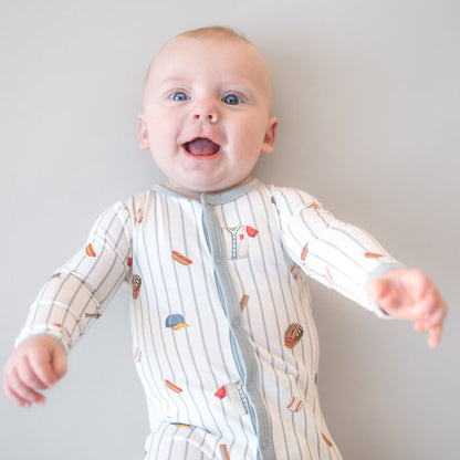 Close up of infant wearing the Footie in Home Run