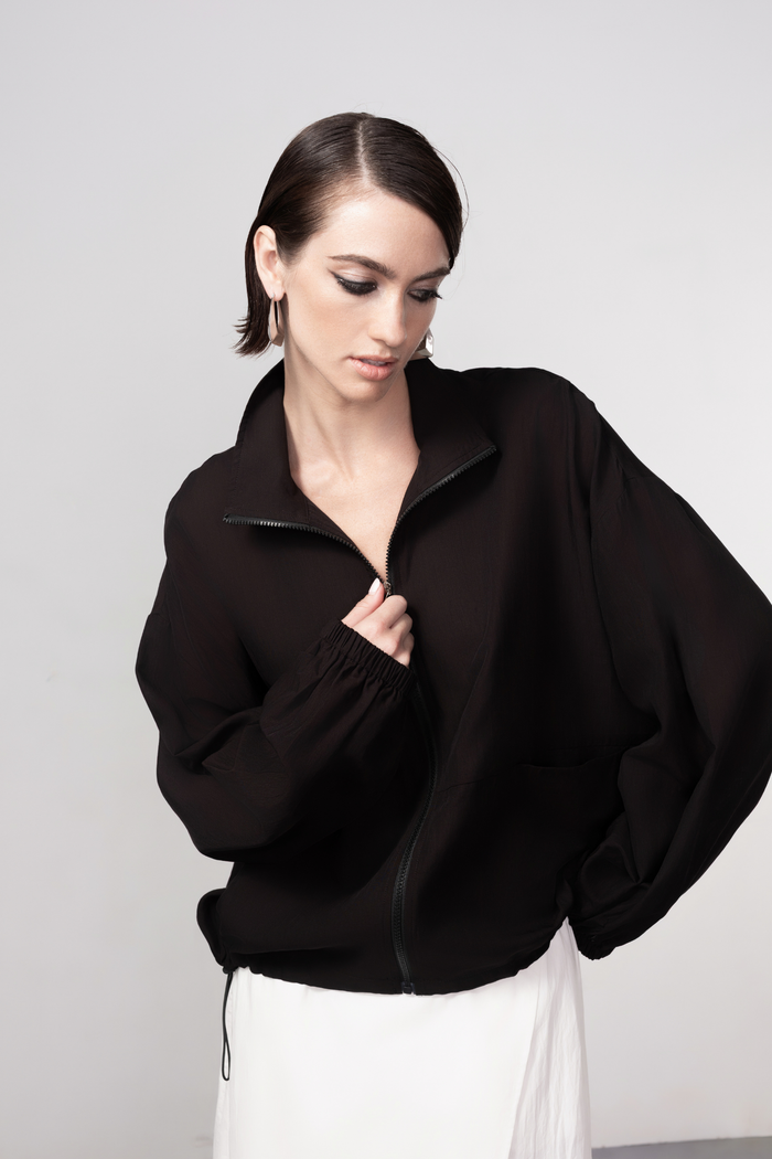 Haako black zip-front bomber jacket with minimalist design and modern silhouette, styled for effortless layering