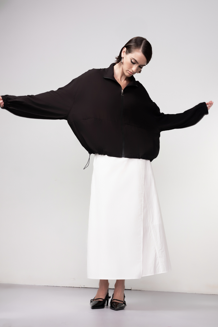 Haako black zip-front bomber jacket with minimalist design and modern silhouette, styled for effortless layering