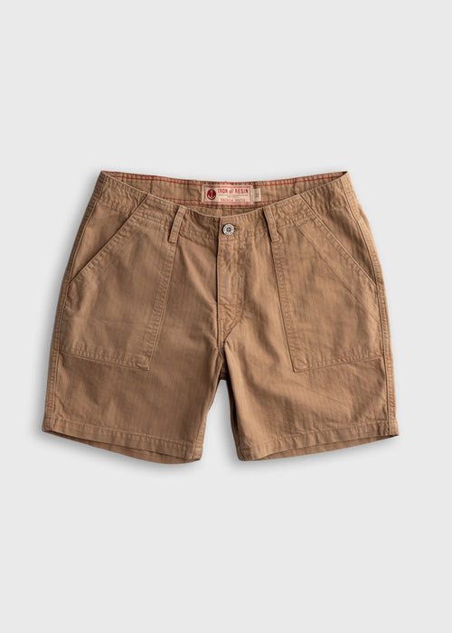 Brown cotton shorts with front pockets, button closure, and branded label, displayed on a white background. Casual style.