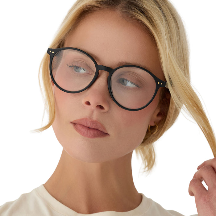 on model - blonde female wearing diff eyewear joanie round glasses with a black acetate frame front view