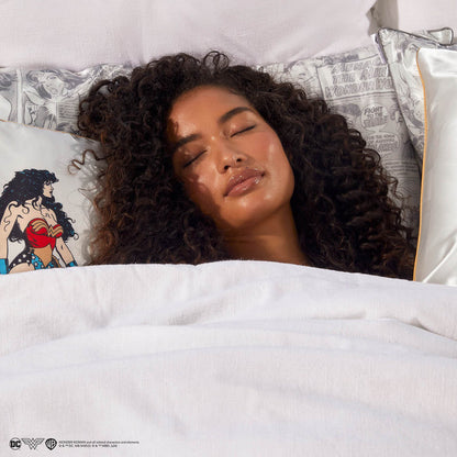 Model sleeping on the Wonder Woman Comic Print Satin Pillowcase
