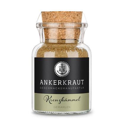 Kreuzkümmel Gemahlen von Ankerkraut im Korkenglas auf weißem Hintergrund.