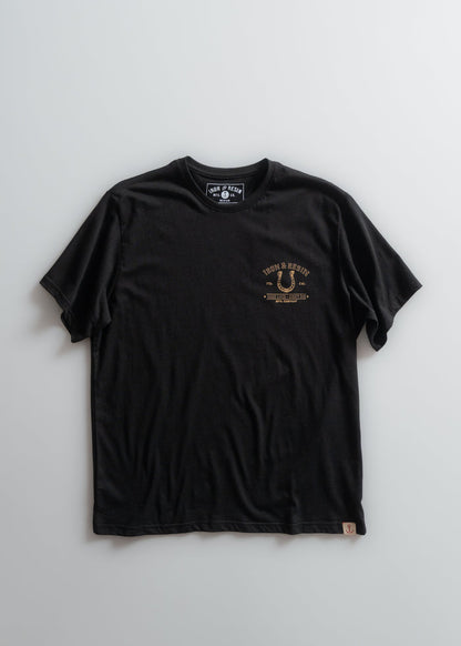 Black Iron & Resin T-shirt with small front logo design on a plain background, showcasing casual style and brand identity.