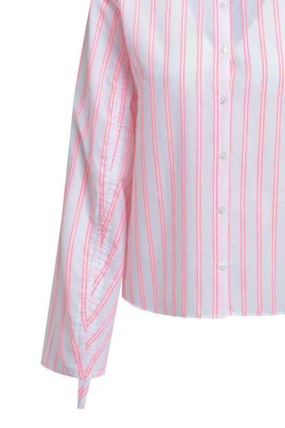 A fresh, lightweight shirt blouse from Milano Italy in a soft pink base with neon coral stripes. Shop now at Dotique.