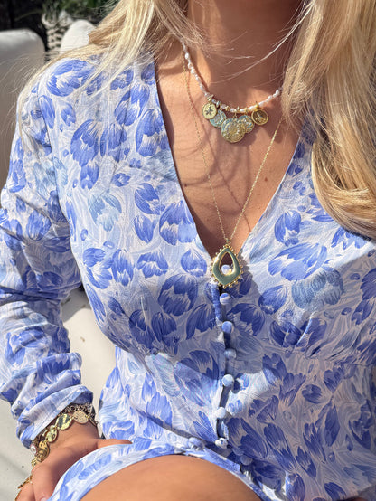 Summer jewellery stack with chunky gold necklaces