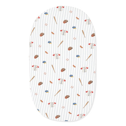 Oval Bassinet Sheet in Home Run shown on an oval mattress