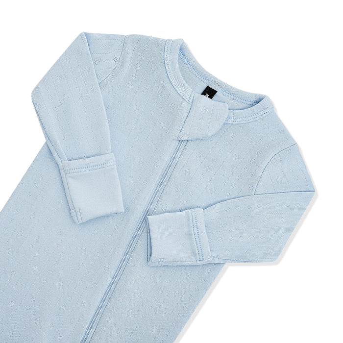 Close up of the zipper garage and fold over handcuffs on the Pointelle Zippered Footie in Breeze