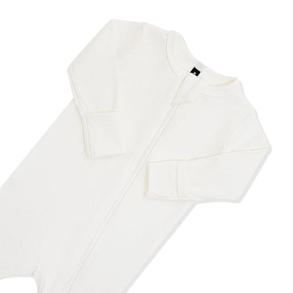 Close up of the zipper garage and fold over hand cuffs on the Pointelle Zippered Footie in Cloud