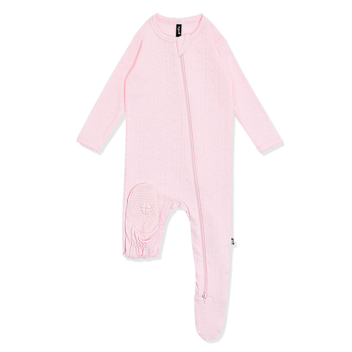 The bottom of the foot pad with the kyte baby log shown on the Pointelle Zippered Footie in Sakura
