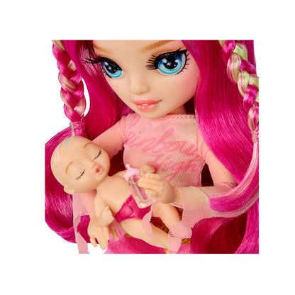 Close up of doll holding baby on a white background