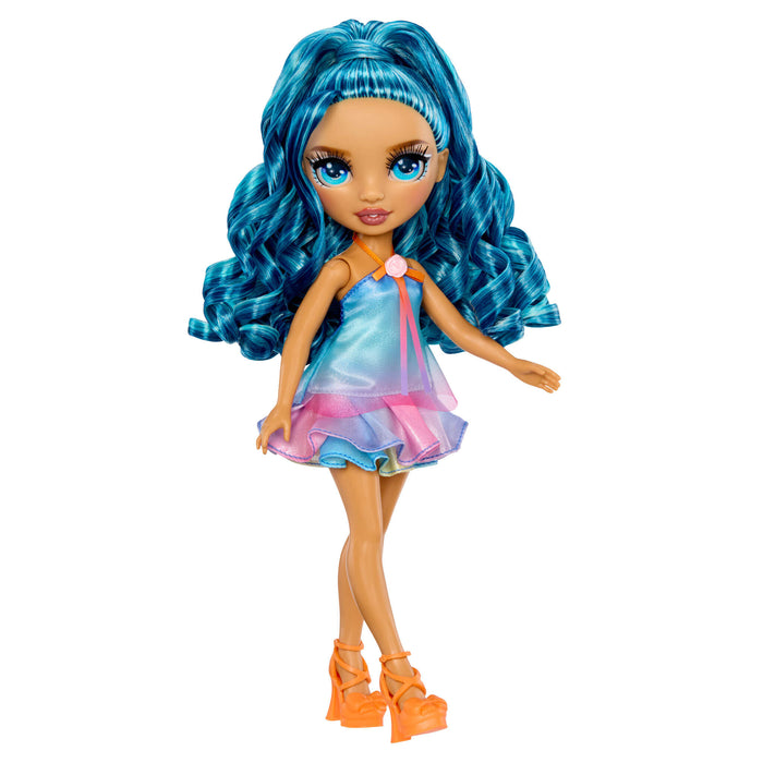 Doll with blue hair, blue and pink dress and orange high heels on a white background