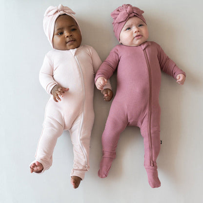 Babies wearing Kyte Baby Ribbed Headwraps with knotted bow