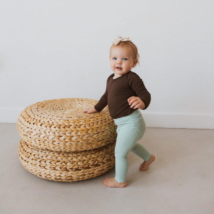 Infant Wearing Kyte Baby Ribbed Leggings in Sage