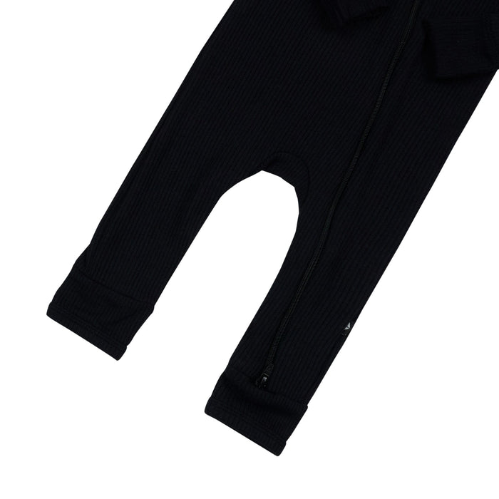 Open feet on Kyte Baby Ribbed Zippered Romper in Midnight