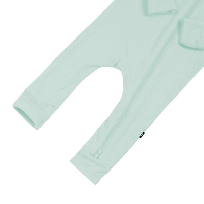 Open feet on Kyte Baby Ribbed Zippered Romper in Sage
