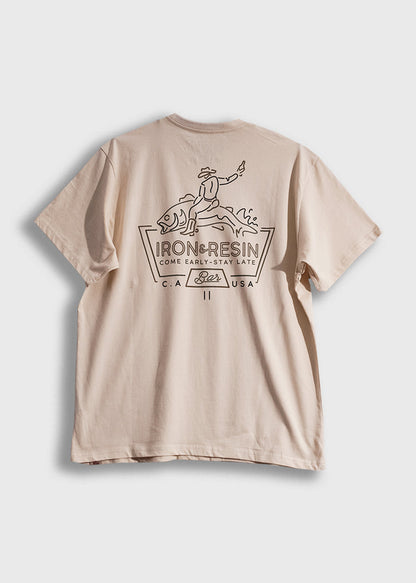 Beige T-shirt with Iron & Resin logo, featuring a cowboy riding a fish, and text "Come Early-Stay Late" in bold design.