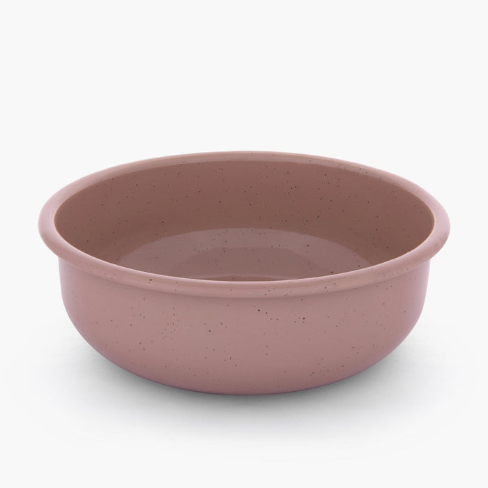 A dusty rose rolled enamel bowl on a white background