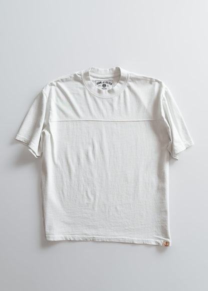 White T-shirt on a light background, featuring a round neck and short sleeves. The label reads "Iron & Resin" with a small anchor logo.
