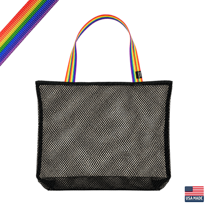 Black mesh tote bag with rainbow handles on a white background. Sand Island mesh beach tote made in Washburn Wisconsin for beach days, sports gear, towels, and lake adventures.