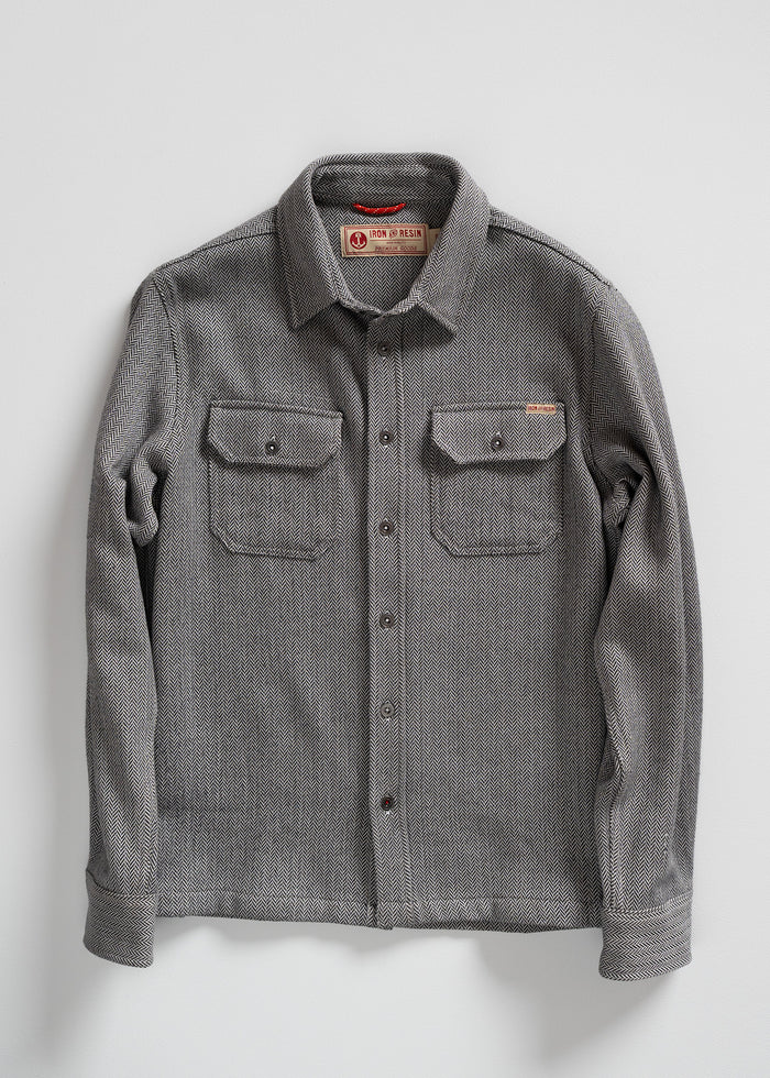 Gray herringbone button-up shirt with two chest pockets, displayed on a white background. Iron & Resin label visible inside.