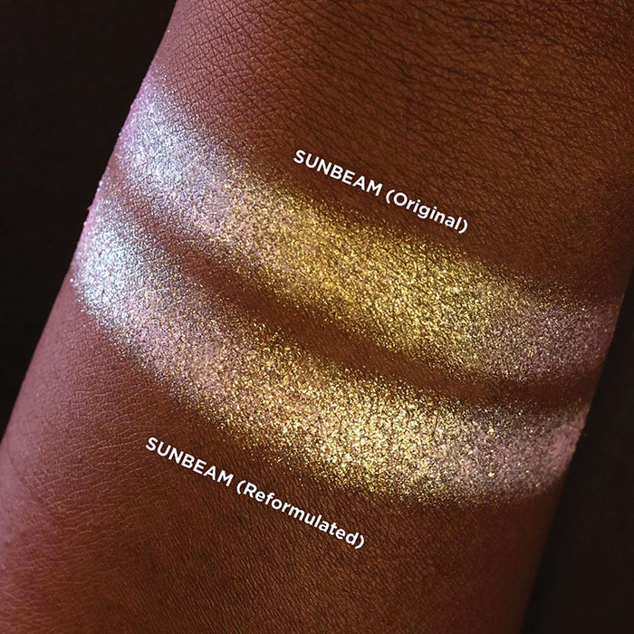 Arm swatch comparisons of Sunbeam (original) and Sunbeam (reformulated) on deep skin tone