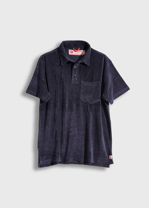 Navy blue terry cloth polo shirt with a pocket, buttoned collar, and red label, displayed against a plain background.