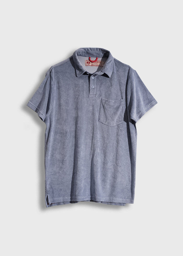 Blue short-sleeve polo shirt with a pocket, buttoned collar, and visible tag, displayed on a plain white background.