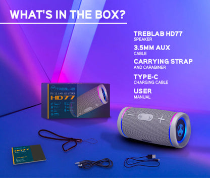 Treblab HD77 speaker with packaging and accessories on a blue background