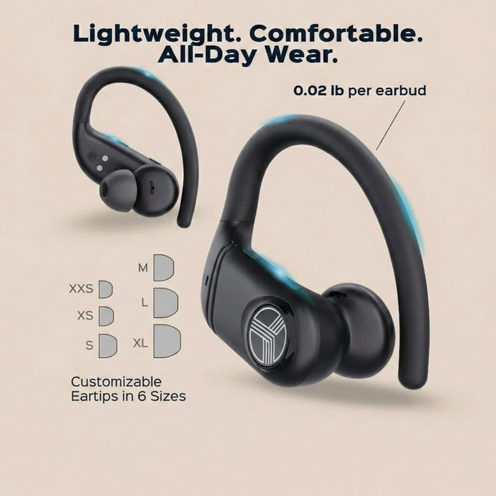 Black wireless earbuds with customizable ear tips on a beige background