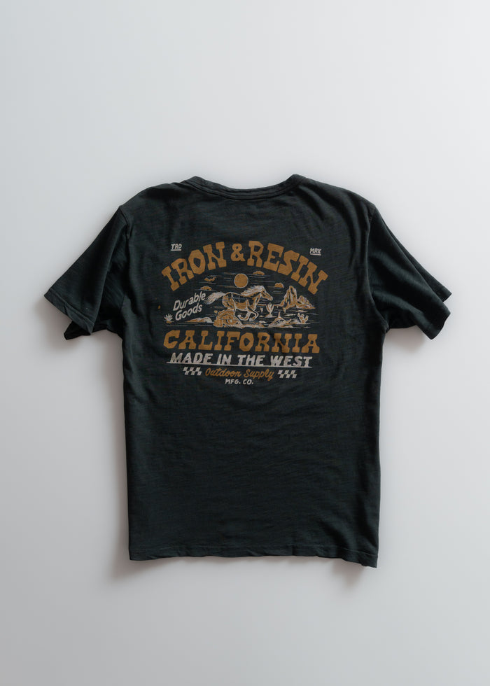 Black T-shirt with "Iron & Resin" and "California Made in the West" printed in bold, featuring a desert scene graphic.