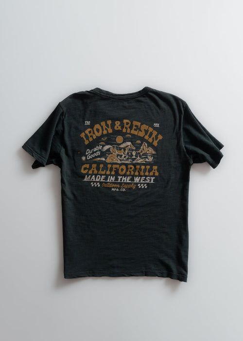 Black T-shirt with "Iron & Resin" and "California Made in the West" printed in bold, featuring a desert scene graphic.