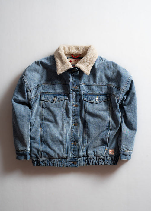 Denim jacket with a cozy shearling collar, buttoned front, and two chest pockets, displayed against a plain white background.