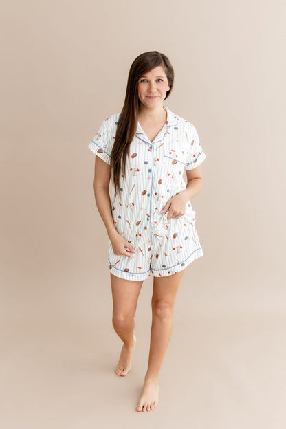 Smiling female modeling the Women's Short Sleeve Pajama Set in Home Run