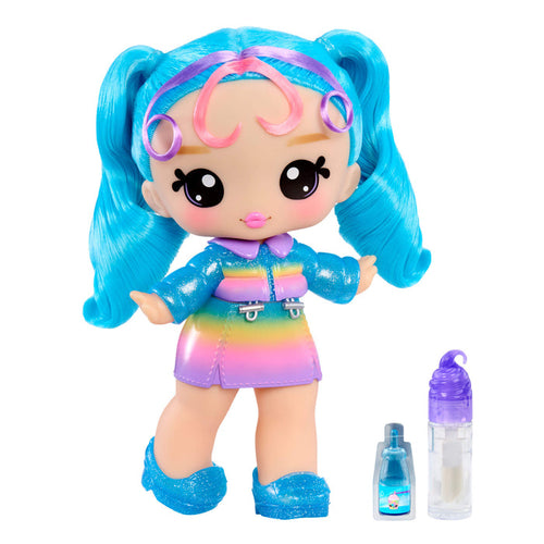 Toy doll with blue hair and rainbow outfit, accompanied by a small bottle on a white background