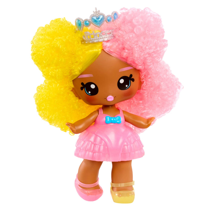 Toy doll with pink and yellow hair, wearing a tiara and dress on a white background
