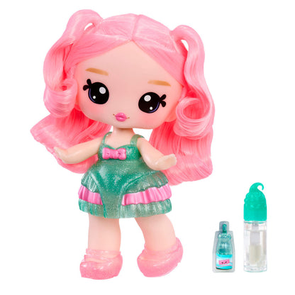Toy doll with pink hair and green dress, accompanied by a small bottle on a white background