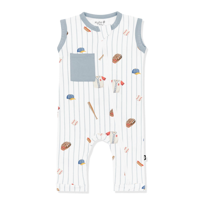 Zippered Sleeveless Romper in Home Run with the muted blue trim and pocket on a white surface